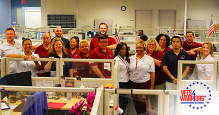 Group photo of people in a call center.