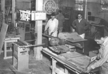 Black and white image of veterans in a woodworking shop at VA in the 1960s.