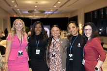 Group photo of women in business attire.