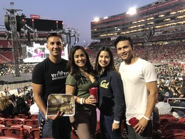 Two couples at a music concert.