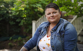 Female Veteran wearing denim jacket.