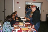 A Veteran being helped at a community event.