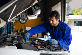 Man working on a car.