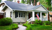 Single family home with the US flag
