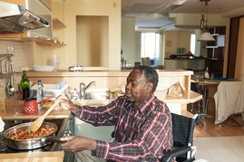 Disabled Veteran cooking in his specially adapted home