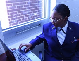 Service member using laptop