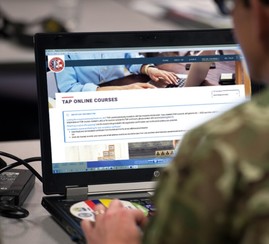 Transitioning service member takes a Transition Assistance Program course on laptop