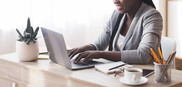 Black Woman At Laptop From Side Stock Photo