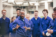 Students and instructor in a factory