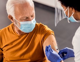 Veteran receiving his COVID-19 vaccine