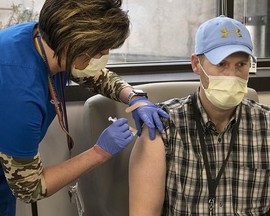 Veteran receiving his COVID-19 booster vaccine