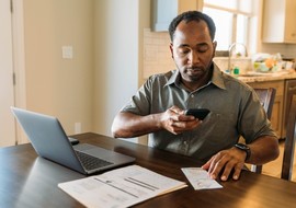 Man managing VA debt online