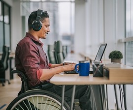 Disabled man watching theSITREP podcast's episode on VA back pay