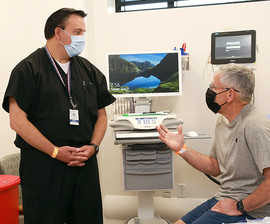 VA physician meeting with a male patient