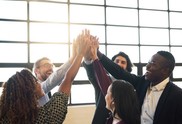 Group of employees celebrating with a high-five