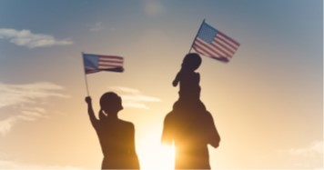 family holding american flag