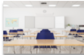 empty classroom with tables and chairs