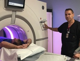 Man being screened for lung cancer with a CT scan