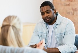 Man talking with counselor