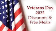 The U.S. flag against a white background with the words, Veterans Day 2022 Discounts and Free Meals