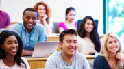 A group of college students sitting in a classroom