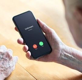 Woman receiving a suspicious call on her mobile phone