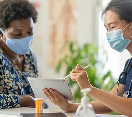 Woman meeting with her VA health care provider