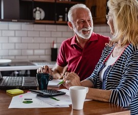 Senior couple using online banking features for their new no-cost account