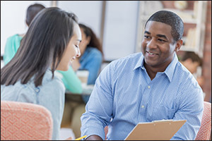Man and woman talk while sitting