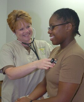 Heath provider meets with a service member