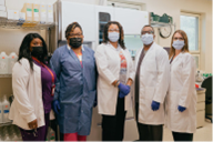 five medical technologists standing