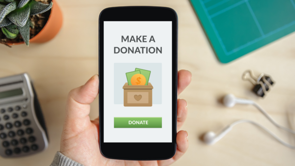 Phone with "Make a Donation" image on screen