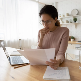 woman works on her taxes at home