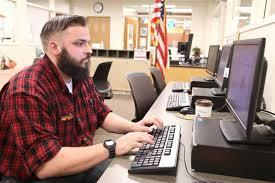 Image of a man at a computer