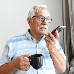 man looks at phone with a skeptical look