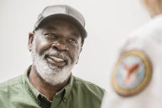 Male Veteran talking to doctor