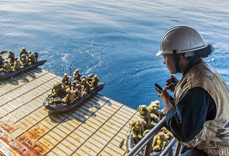 Marines preparing to depart in small boats