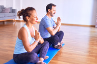 Veteran and partner practicing yoga