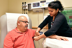 A male Veteran having blood pressure taken