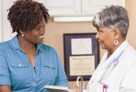 Woman Veteran talking to her doctor