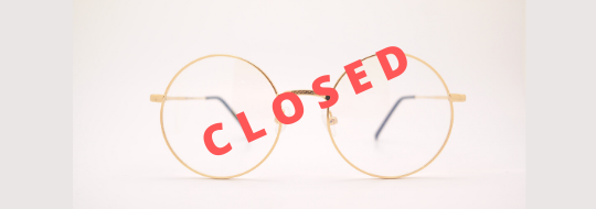 Glasses with the word closed over them.