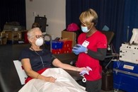 A Veteran talking to a member of his health care team