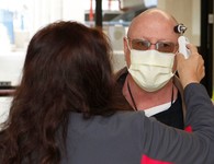 A Veteran wearing a mask during his VA appointment