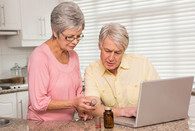 A Veteran and partner review their prescriptions