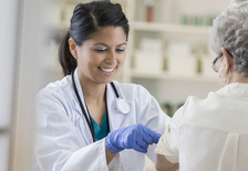 female physician gives a flu shot