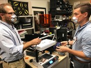 Rehabilitation engineers discussing mask