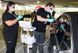 A Veteran being screened before entering his local VA facility 