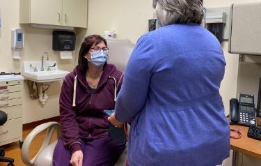 A Veteran talking to her doctor about a lung cancer screening 