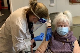 A Veteran receiving a COVID-19 vaccine