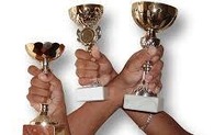 3 hands hold Award Cups 